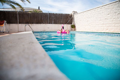 Woman swimming in pool