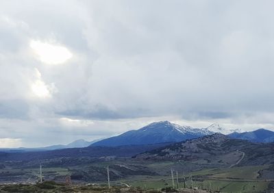 Scenic view of snowcapped mountains against sky