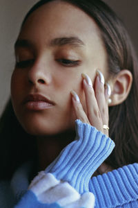 Close-up of young woman looking down