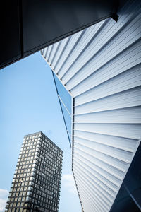 Low angle view of modern buildings against sky