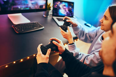 Friends playing video game. gamers playing championship tournament. competition and having fun