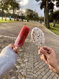 Midsection of person holding ice cream cone