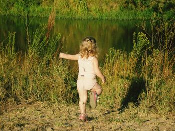 Full length of woman standing on grass