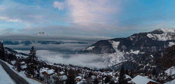 Scenic view of snowcapped mountains against sky