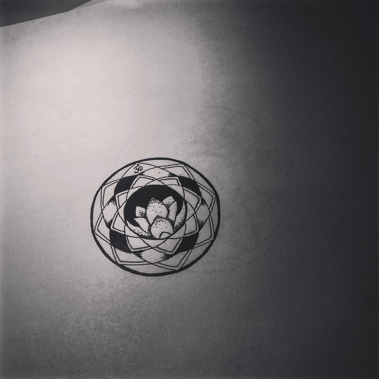 indoors, ceiling, wall - building feature, circle, pattern, lighting equipment, close-up, design, hanging, geometric shape, built structure, copy space, electricity, no people, home interior, directly below, low angle view, wall, architecture, single object