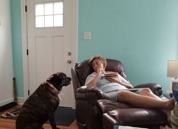 Woman with dog relaxing at home