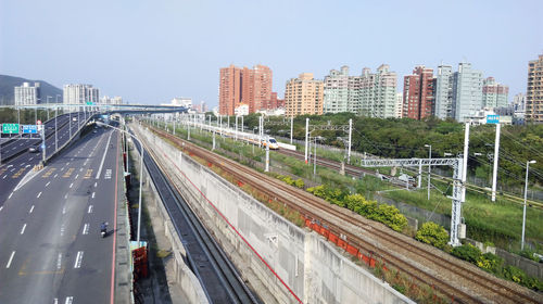 High angle view of street amidst buildings against clear sky