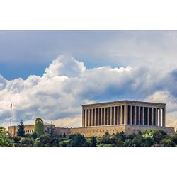 Low angle view of building against cloudy sky