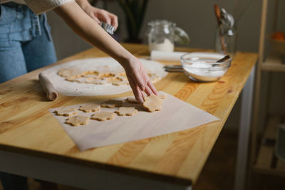 Young woman making christmas cookies