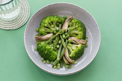 High angle view of vegetables in plate on table