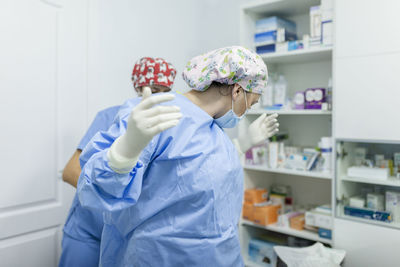 Healthcare worker in uniform working at veterinary clinic