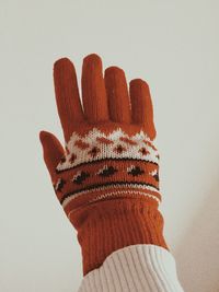 Close-up of hand against white background