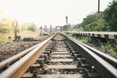 Surface level of railroad tracks against sky