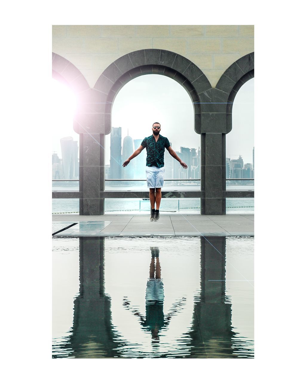 MAN STANDING ON WATER