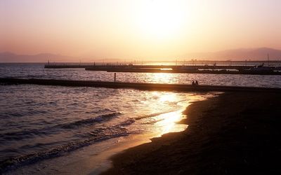 Scenic view of sea at sunset