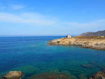 Scenic view of sea against blue sky