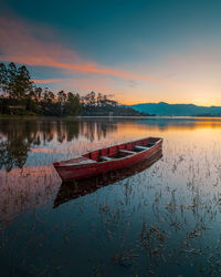 Scenic view of lake against sky during sunset