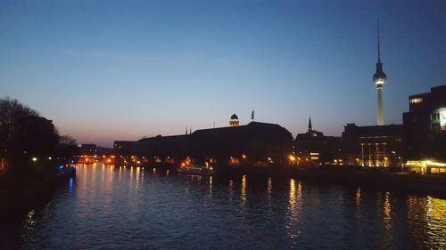 Illuminated buildings at waterfront