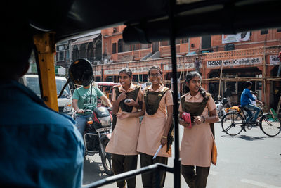 People on street in city