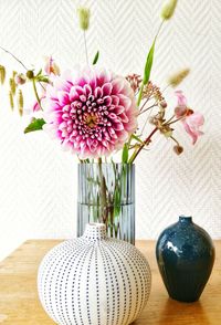 Close-up of pink flower vase on table