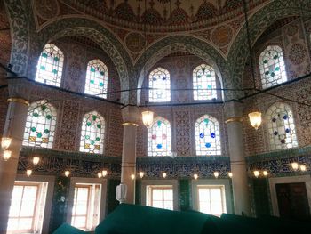 Low angle view of illuminated window in temple