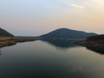 Scenic view of lake against sky during sunset