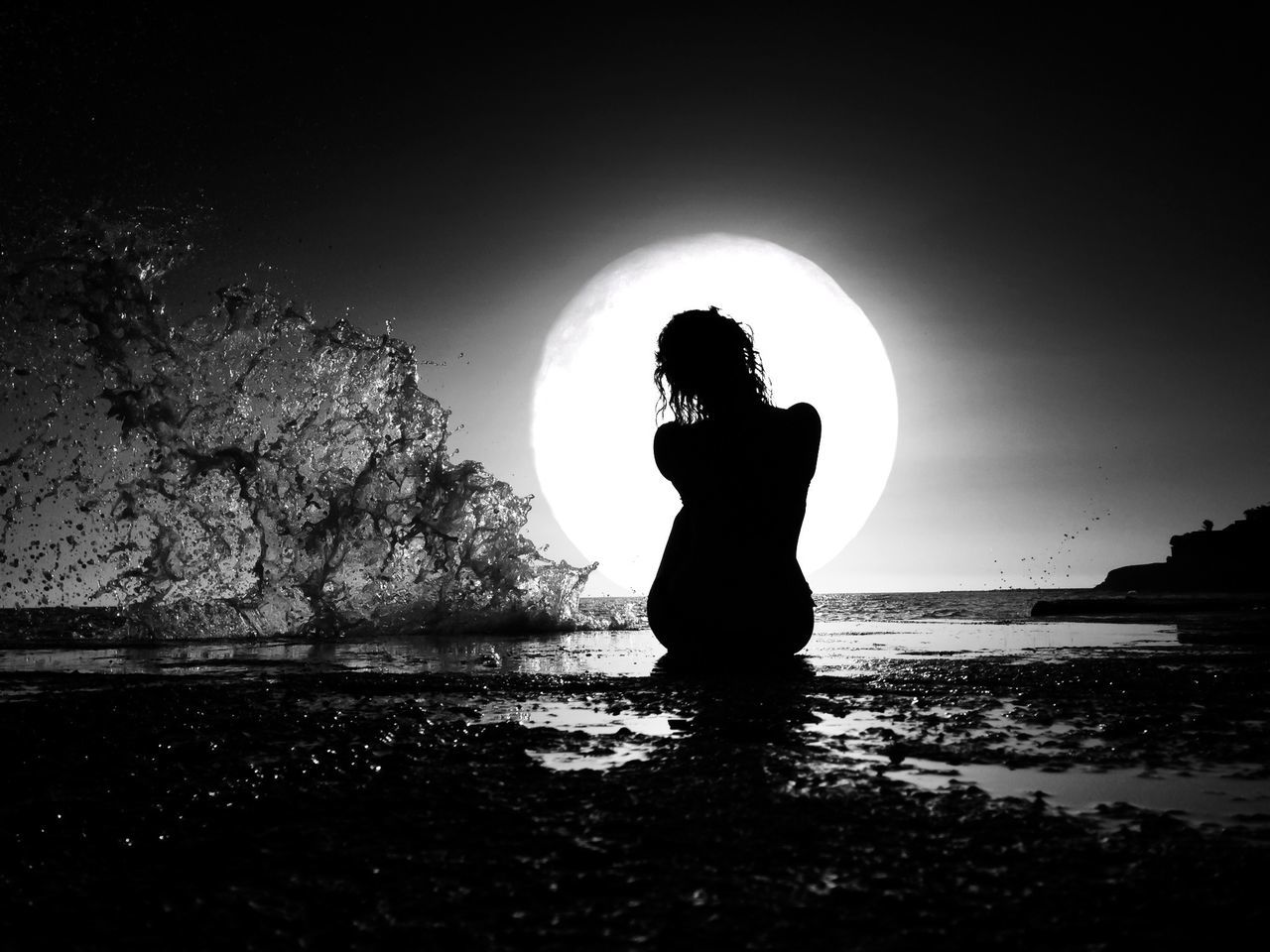 SILHOUETTE OF WOMAN STANDING ON SHORE