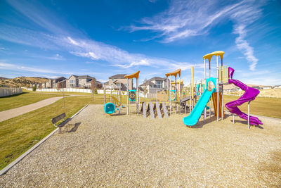 View of playground against blue sky