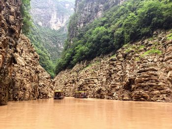 Scenic view of river amidst mountains