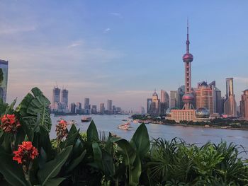 View of buildings in city against sky during sunset