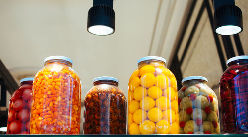 Close-up of multi colored food stored in jar