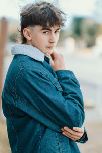 Teenager boy posing showing haircut and style