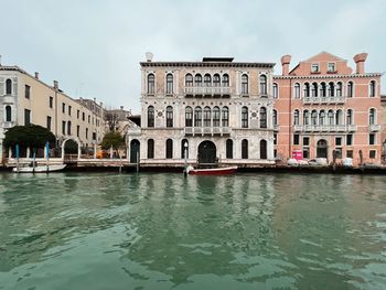 Low angle view of buildings in water