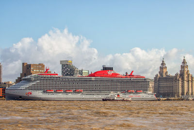 Panoramic view of sea and buildings against sky