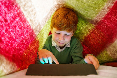 Portrait of boy using mobile phone