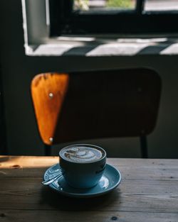 Close-up of coffee cup on table