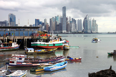 Boats moored at harbor