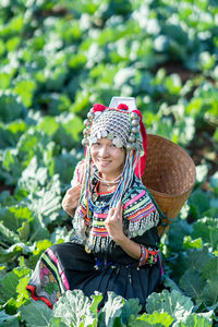 Full length of woman wearing hat on field