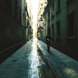 Narrow alley along buildings