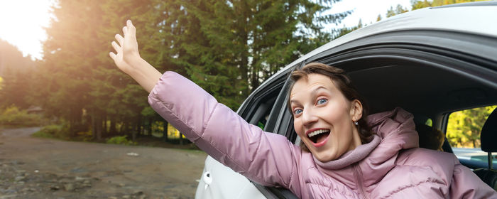 Portrait of happy woman in car
