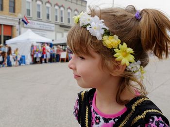 Smiling girl standing outdoors