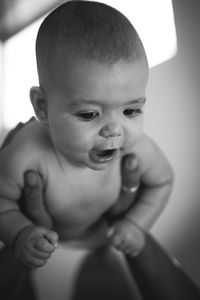 Close-up of cute baby in black and white