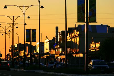 Buildings in city at sunset