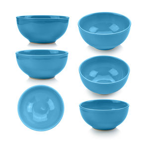 Directly above shot of ceramic kitchen bowls against white background