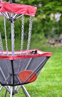 Close-up of red metallic structure in park