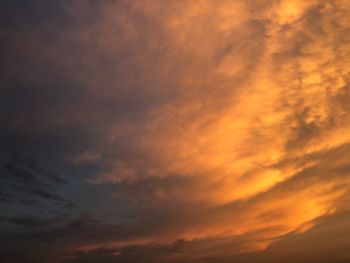 Low angle view of dramatic sky during sunset