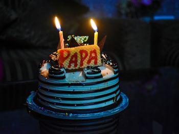 Burning candles on birthday cake