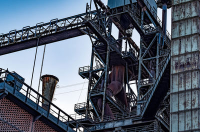 Low angle view of metallic structure against sky