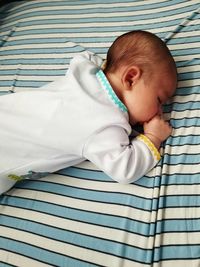 Cute baby sleeping on bed