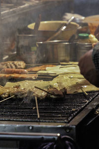 Close-up of meat on barbecue grill